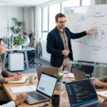 IT consulting expert presenting technology strategy and cybersecurity plans to a business team.